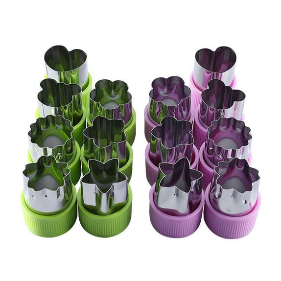 Set of metal cookie cutters in green and pink containers on a white background