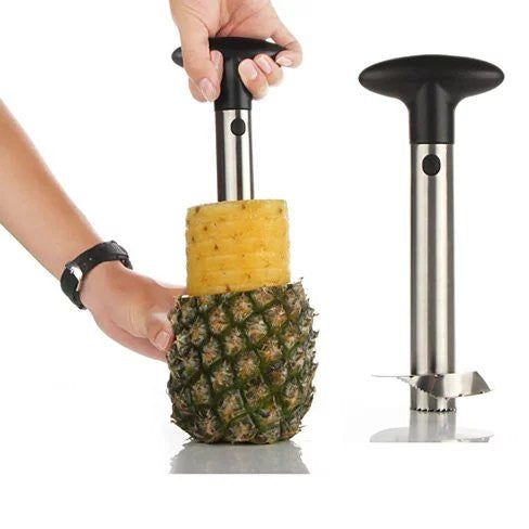 Pineapple peeler being used on a pineapple with a white background