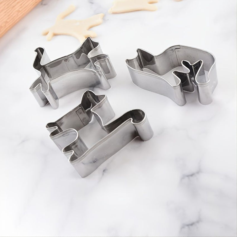 Set of metal cookie cutters on a marble surface