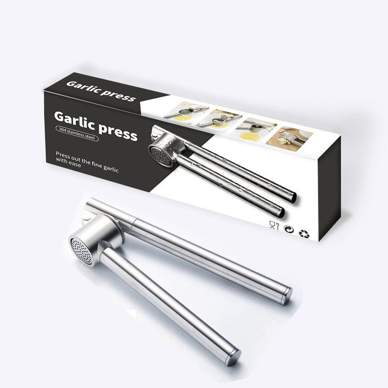 Garlic press with packaging on a white background