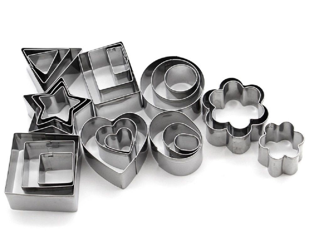 Set of metal cookie cutters in various shapes on a white background