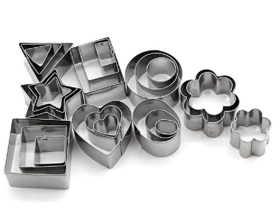 Set of metal cookie cutters in various shapes on a white background