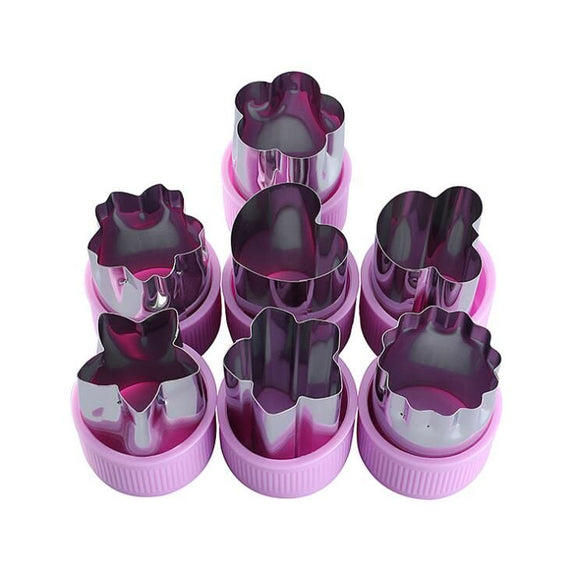 Set of purple and pink cookie cutters with various shapes on a white background