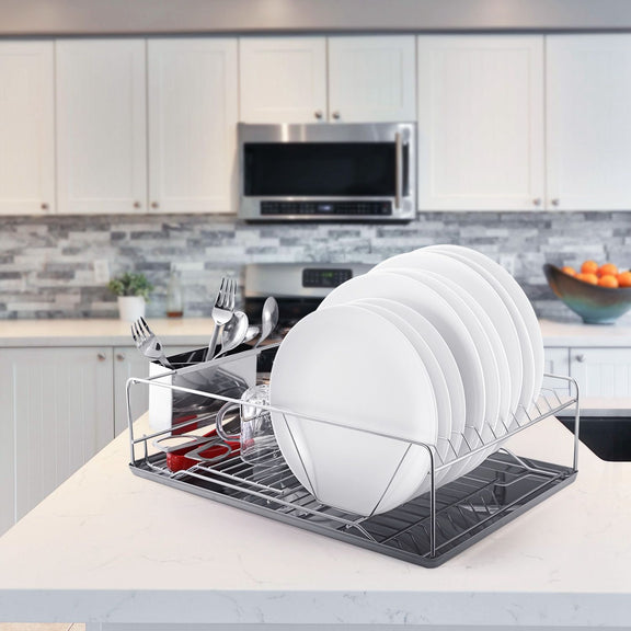 Dish rack with plates and utensils on a kitchen counter