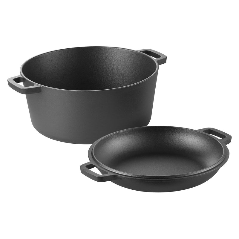 Set of two black cast iron cookware items on a white background
