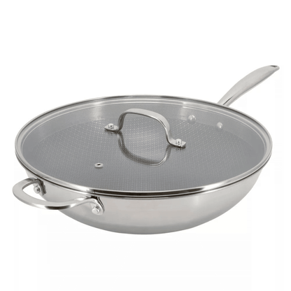 Stainless steel wok with lid on a white background