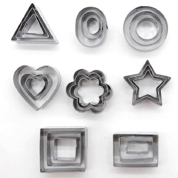 Set of metal cookie cutters in various shapes on a white background