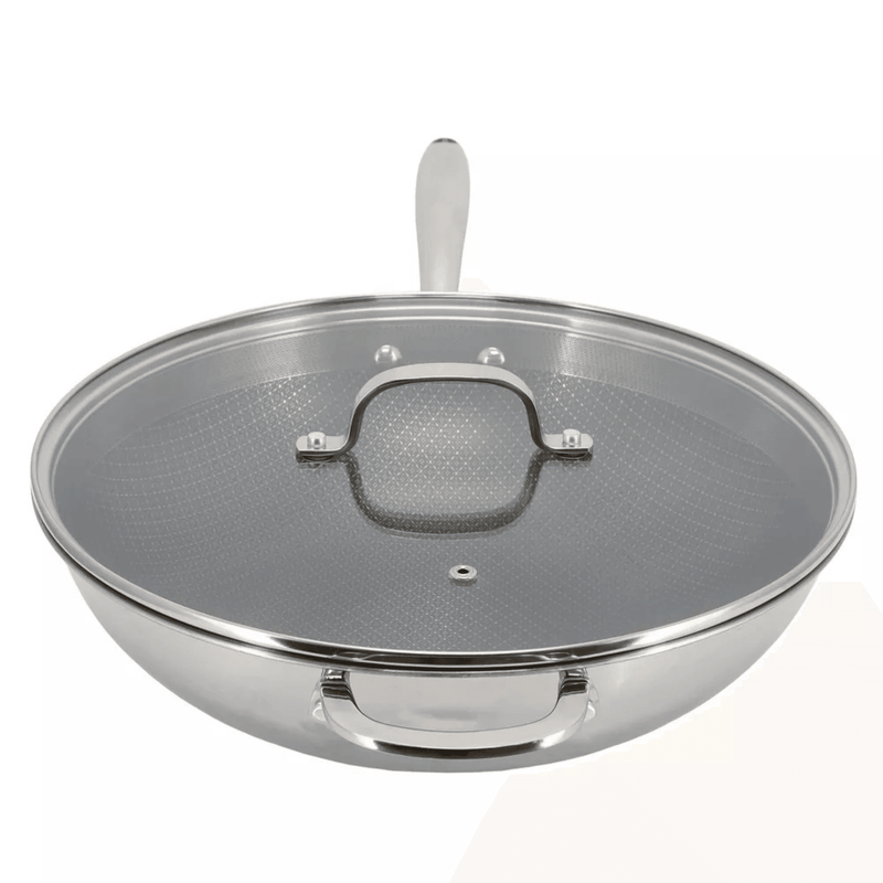 Stainless steel wok with lid on a white background