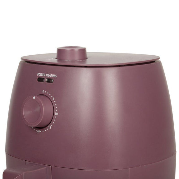 Close up view of Air Fryer with control knob on a white background