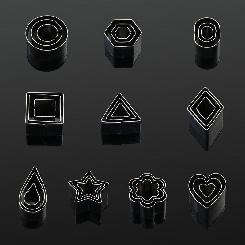 Set of black geometric shape earrings on a dark background