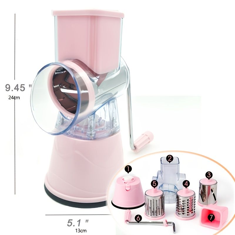 Pink manual hand wind food grater and grater blades on white background