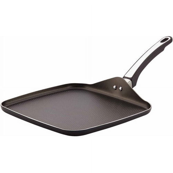 Black frying pan with a textured surface on a white background