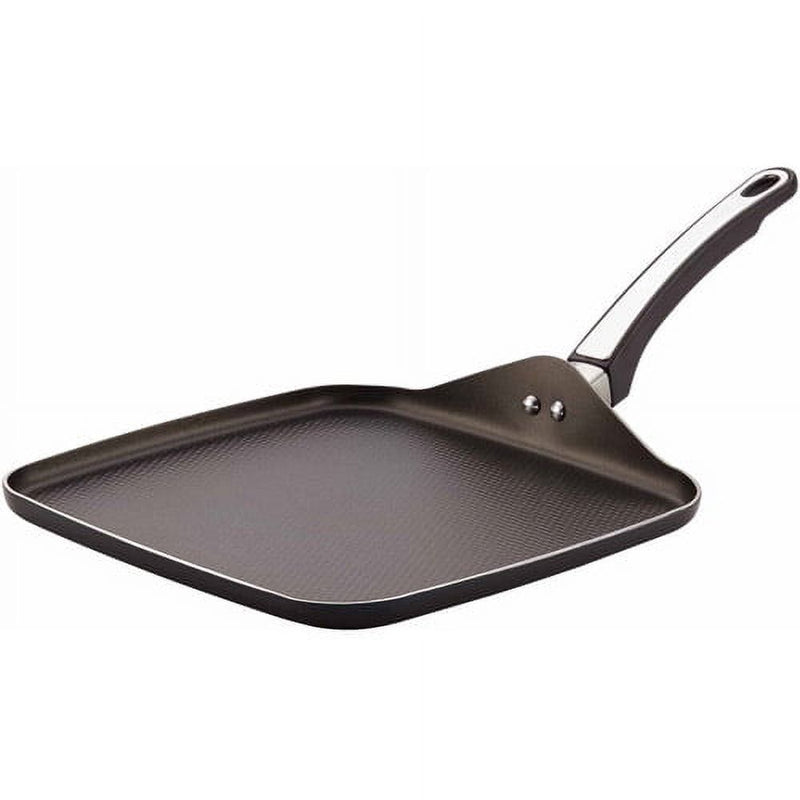 Black frying pan with a textured surface on a white background