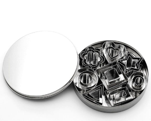 Metallic cookie cutter set with various shapes on a white background