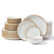 Set of white dinnerware with gold rims on a white background