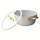 Beige dutch oven with lid on white background