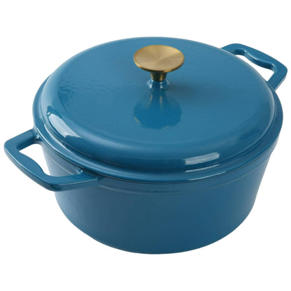 Blue 4.75 quart enameled cast iron dutch oven on a gas stove