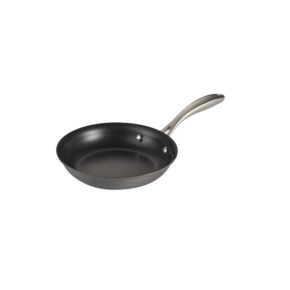 Black frying pan with a silver handle on a white background