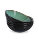 Set of four black ceramic bowls with green interior on a white background