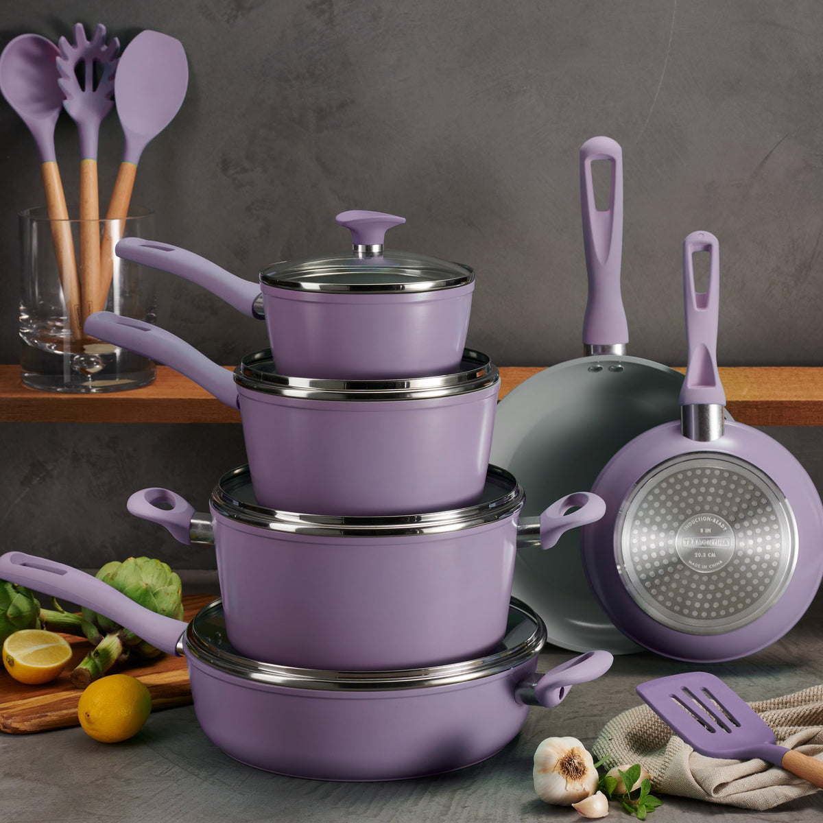 Tramontina Purple cookware set with utensils on a kitchen counter