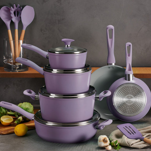 Tramontina Purple cookware set with utensils on a kitchen counter