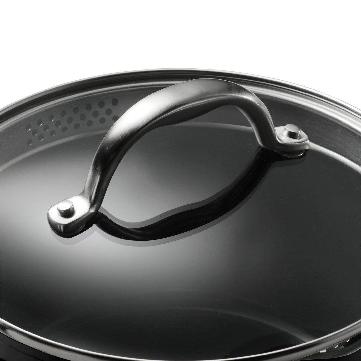 Close-up of a black pot lid with a metallic handle on a white background