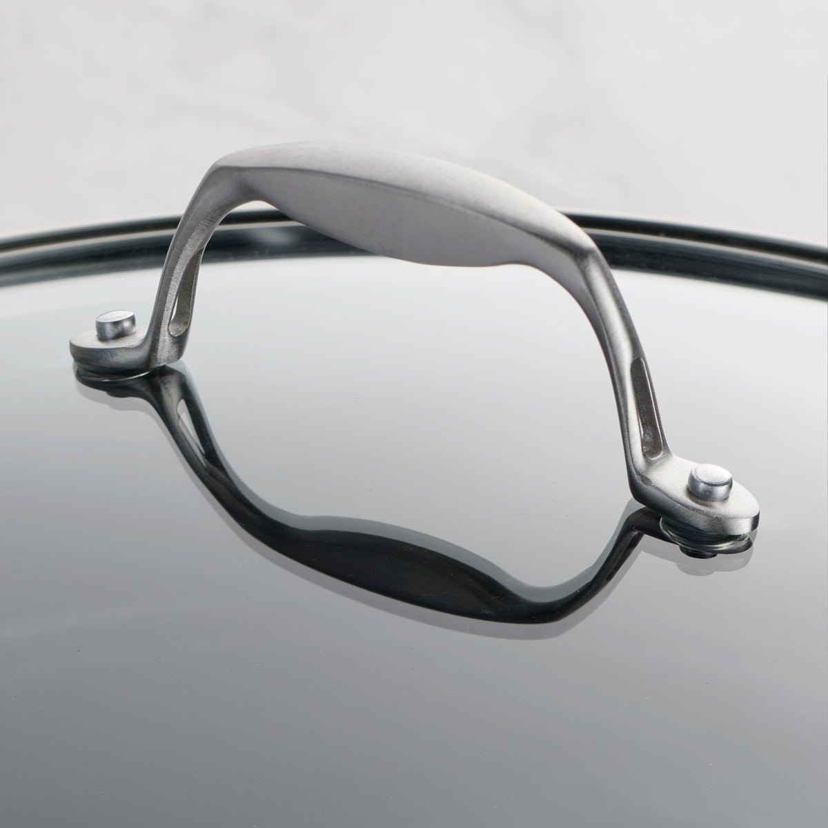 Close-up of a pair of eyeglasses with a reflective surface