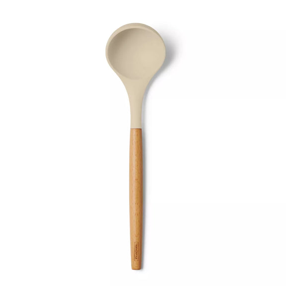 Beige silicone spoon with a bamboo handle on a white background