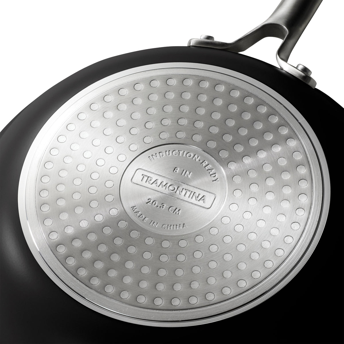 Close-up of a Tramontina frying pan with a textured bottom.