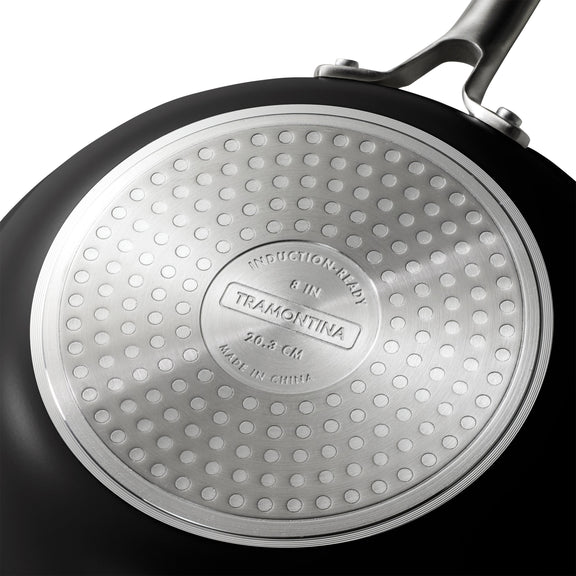 Close-up of a Tramontina frying pan with a textured bottom.