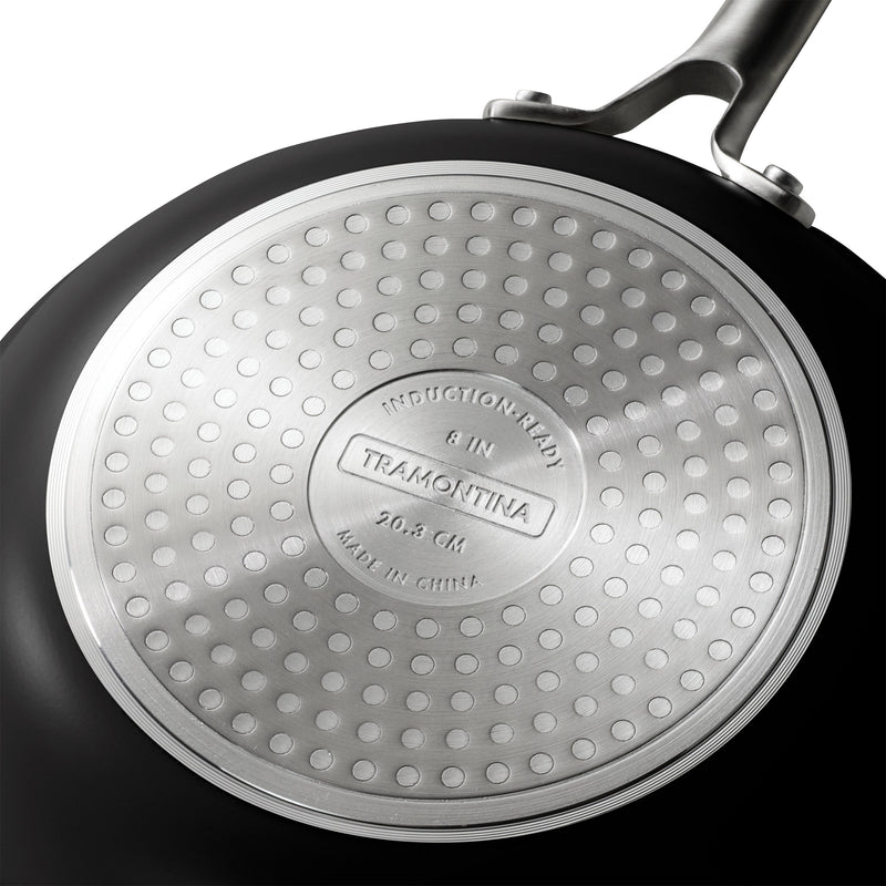 Close-up of a Tramontina frying pan with a textured bottom.
