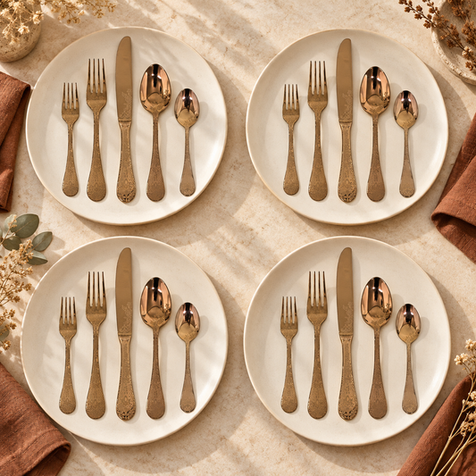 Mepra Coccodrillo Bronzo 20-piece etched bronze flatware arranged as four warm daylight place settings