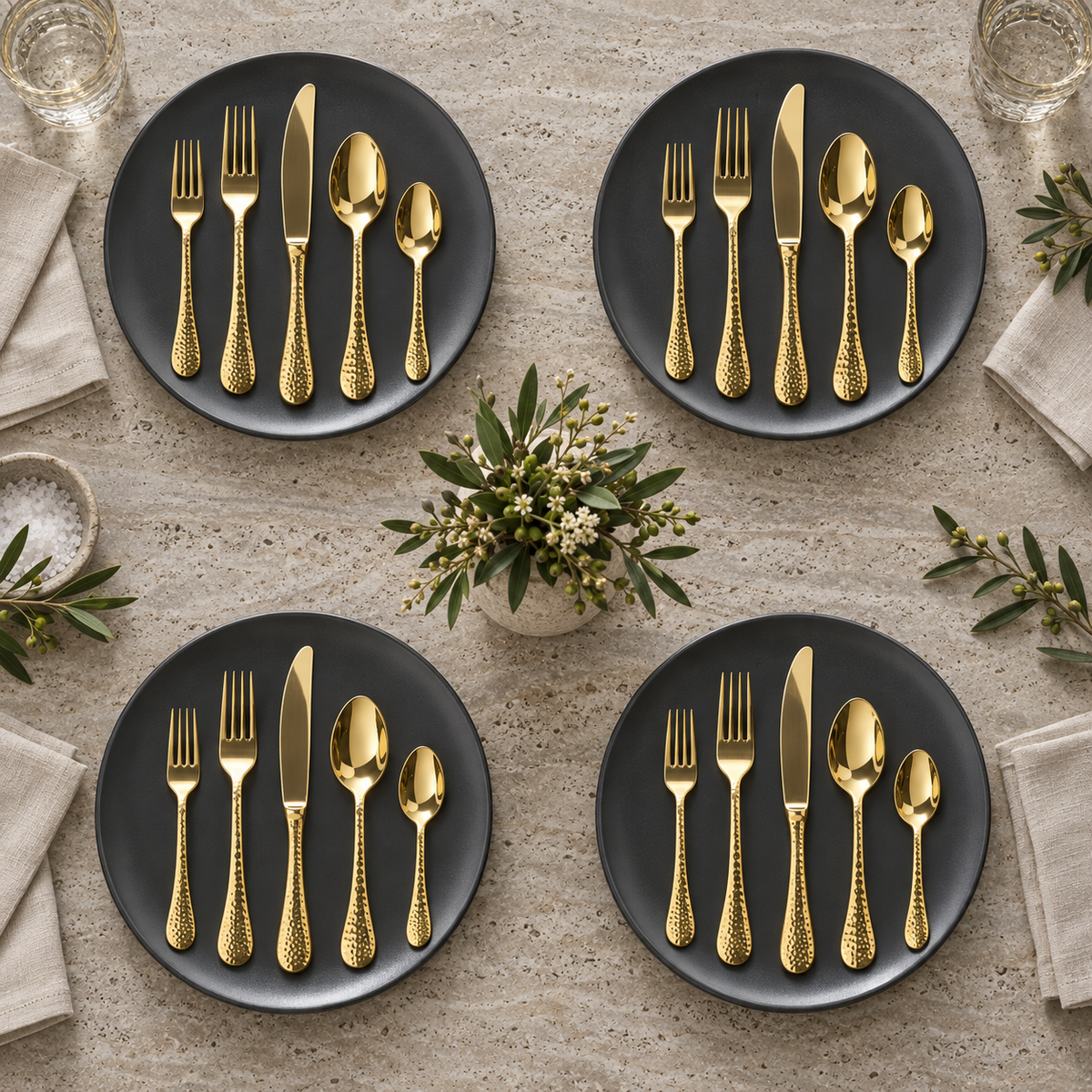 Mepra Epoque Oro 20-piece hammered gold flatware arranged for four modern place settings
