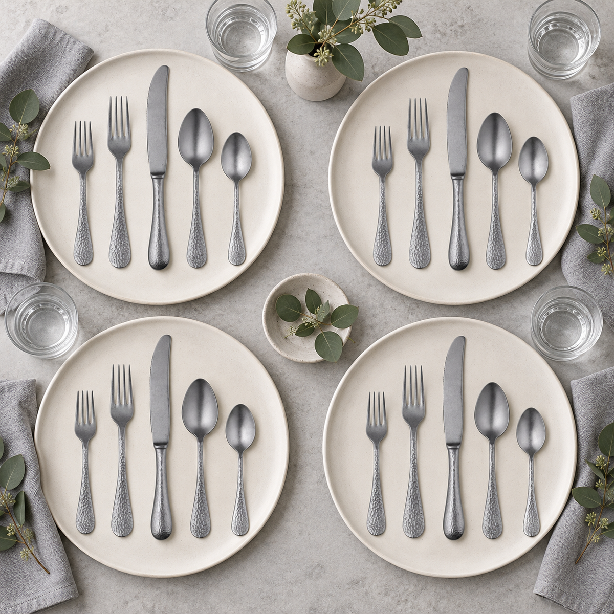 Mepra Epoque Pewter 20-piece flatware set arranged for four modern place settings