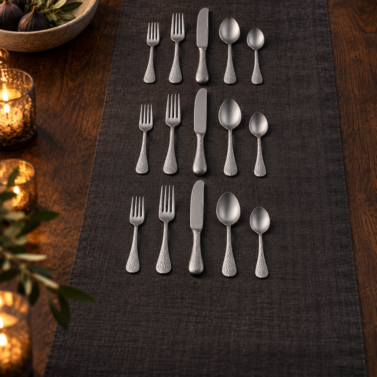 Mepra Epoque Pewter 20-piece hammered flatware set in an elegant evening display