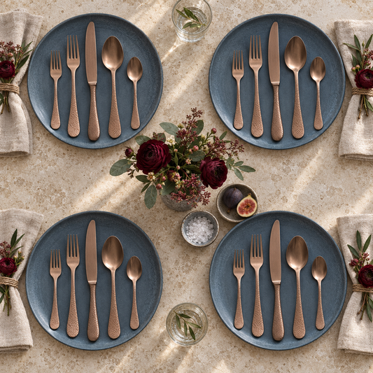 Mepra Epoque Pewter Bronzo 20-piece hammered flatware arranged for four daytime place settings