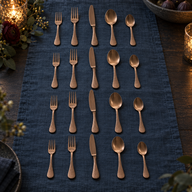 Mepra Epoque Pewter Bronzo 20-piece hammered flatware displayed in four evening rows