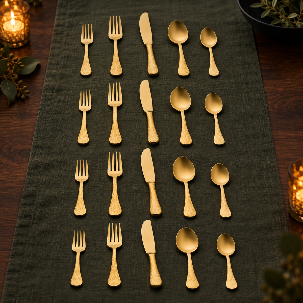 Mepra Epoque Pewter Oro 20-piece brushed gold flatware displayed in four evening rows