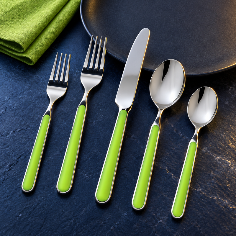 Mepra Fantasia Acid Green five-piece flatware on dark blue stone