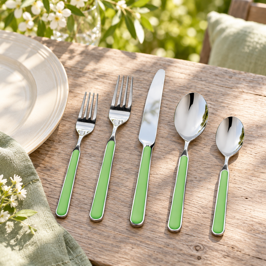 Mepra Fantasia Applegreen five-piece flatware in a garden lunch setting