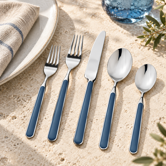 Mepra Fantasia Blue five-piece flatware in a coastal limestone setting