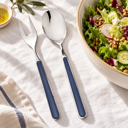 Mepra Fantasia Cobalt two-piece salad servers with navy blue handles on white linen