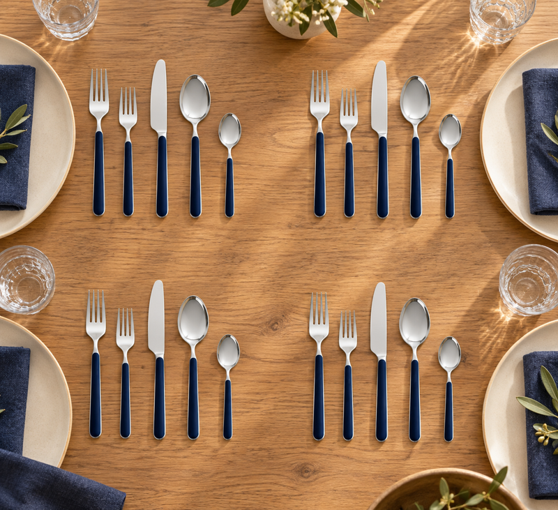 Mepra Fantasia Ice Oro Cobalt 20-piece flatware displayed as four warm contemporary place settings