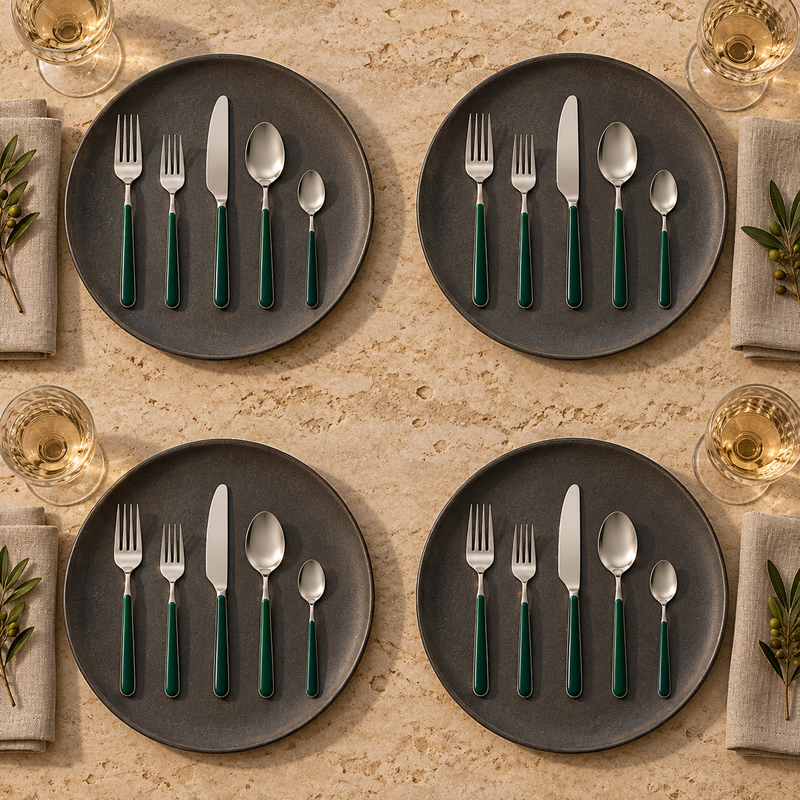 Mepra Fantasia Ice Oro Forrest Green 20-piece flatware displayed as four refined evening place settings