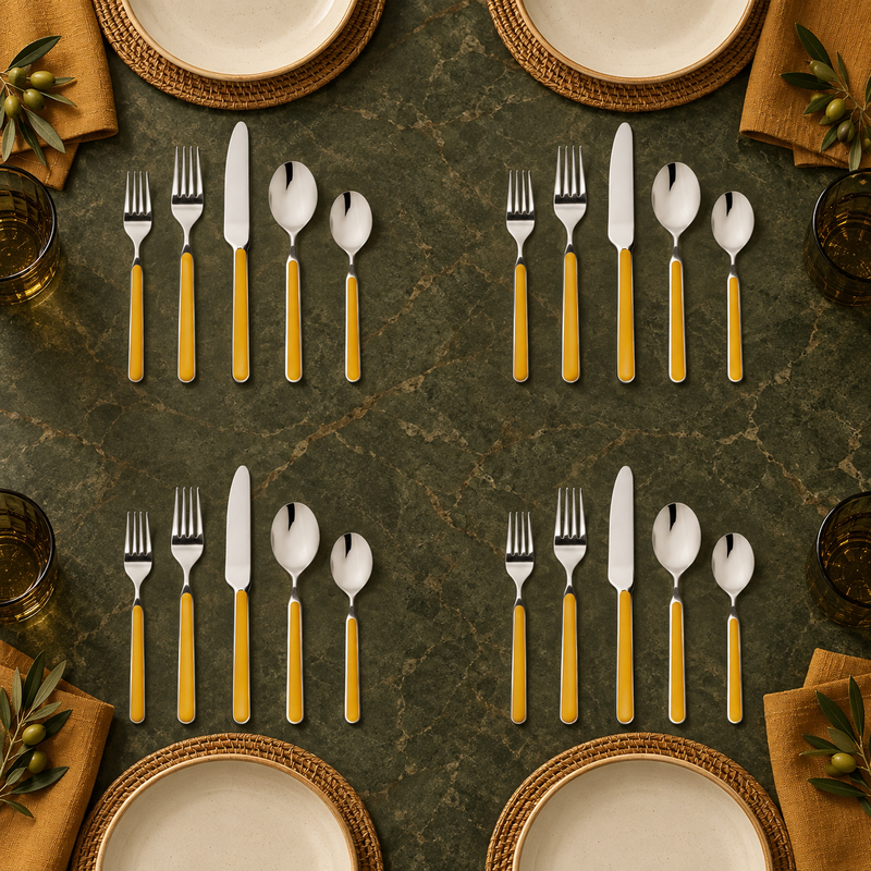 Mepra Fantasia Ice Oro Mustard 20-piece flatware displayed as four sophisticated modern place settings