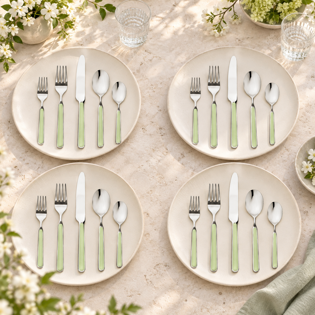 Mepra Fantasia Ice Oro Sage 20-piece flatware arranged as four serene spring place settings