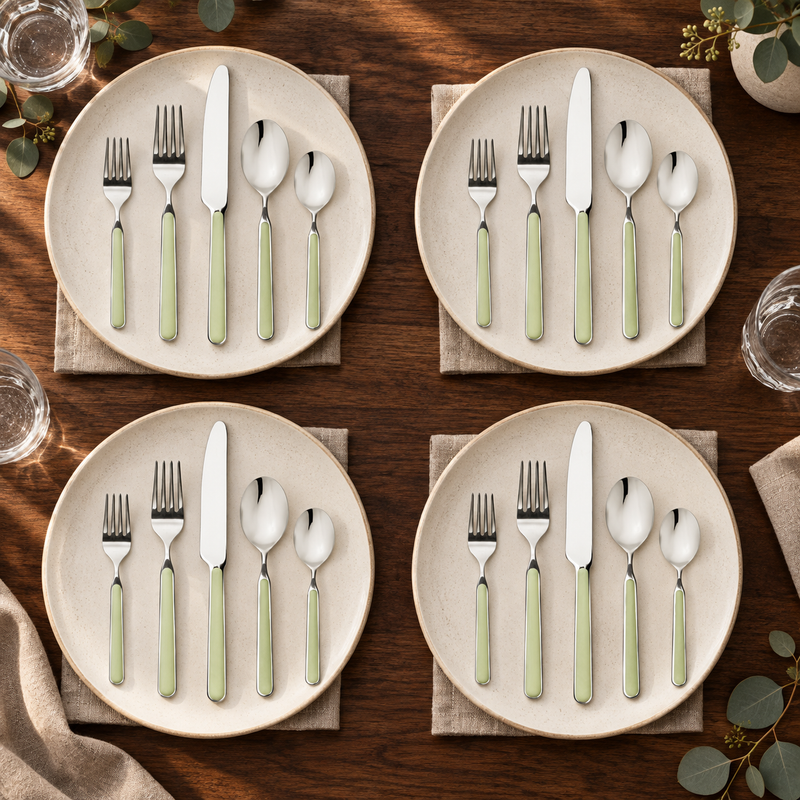 Mepra Fantasia Ice Oro Sage 20-piece flatware displayed as four warm contemporary place settings