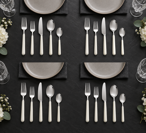 Mepra Fantasia Ice Oro White 20-piece flatware displayed as four minimalist formal place settings
