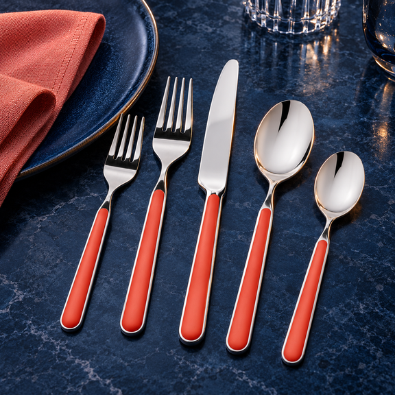 Mepra Fantasia New Coral five-piece flatware on midnight blue stone