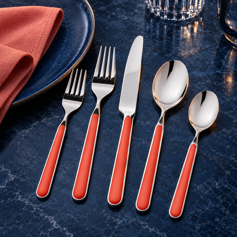 Mepra Fantasia New Coral five-piece flatware on midnight blue stone